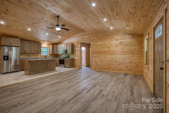 3161 Morganton Furniture Rd, Valdese, NC 28690 - kitchen with wood walls, stainless steel appliances, open floor plan, vaulted ceiling, and wood ceiling