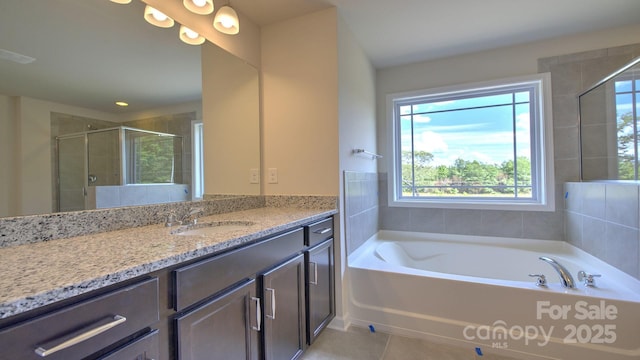 bathroom with tile patterned floors, vanity, and plus walk in shower