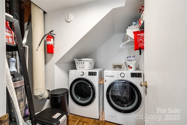 washroom featuring dark parquet flooring and independent washer and dryer