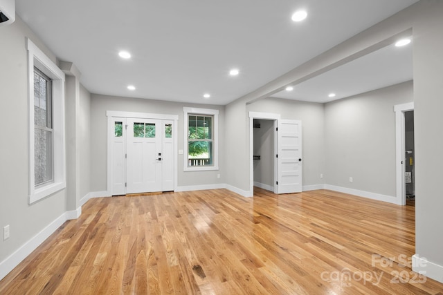 foyer with light hardwood / wood-style floors