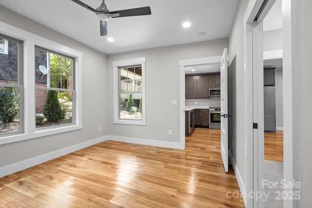 interior space featuring light hardwood / wood-style floors and ceiling fan