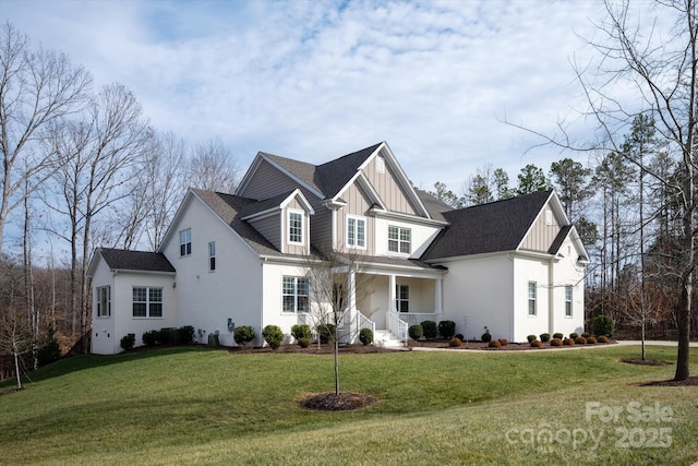 view of front facade with covered porch and a front lawn