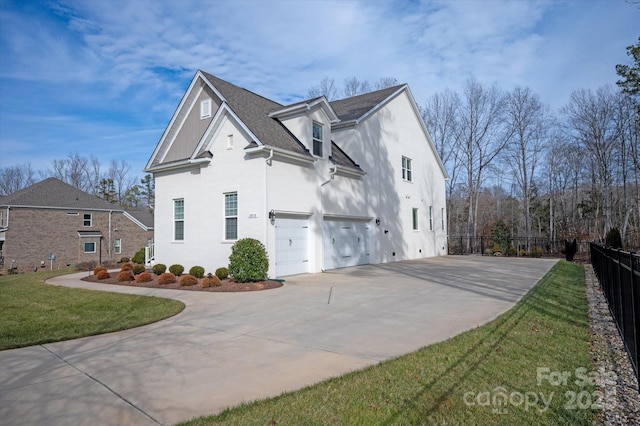 view of property exterior featuring a garage and a yard