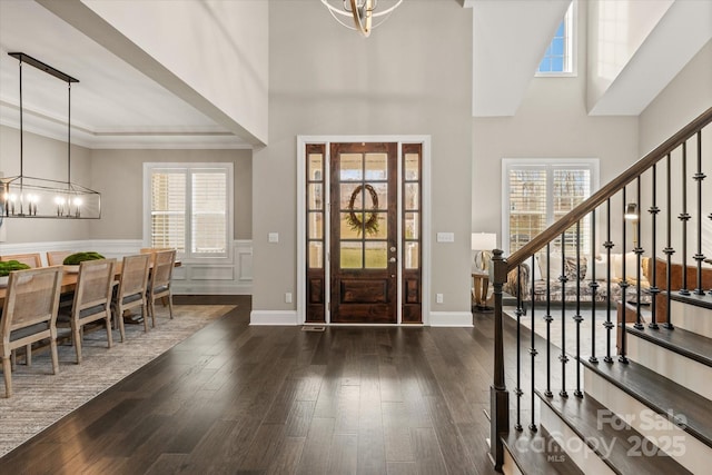 entryway featuring a healthy amount of sunlight and a chandelier