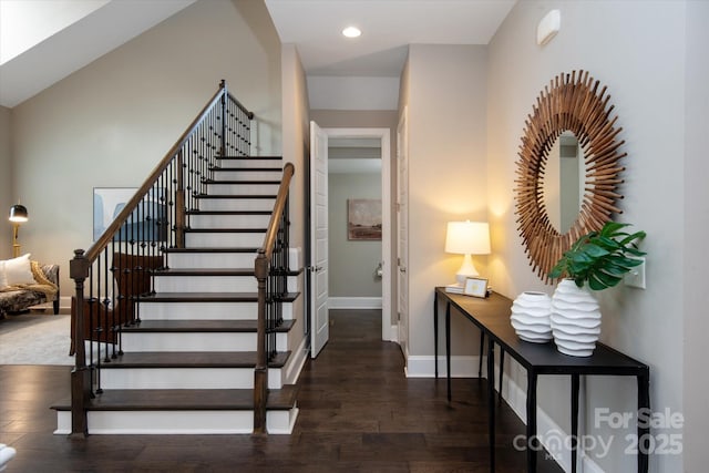 stairs featuring wood-type flooring