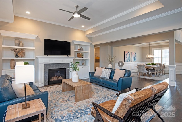 living room featuring crown molding, hardwood / wood-style flooring, and ceiling fan