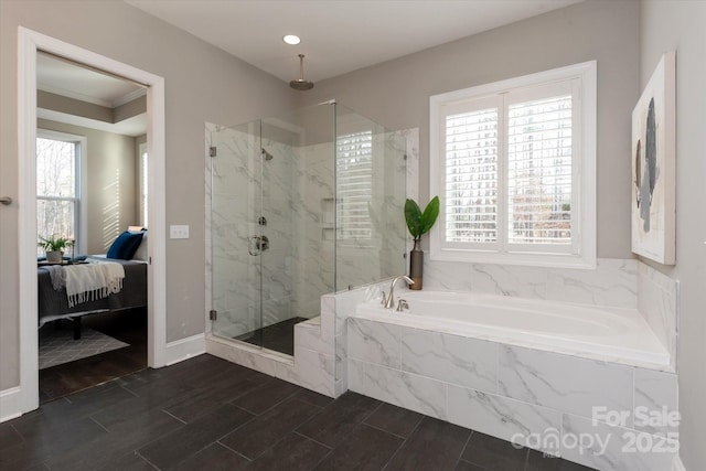 bathroom featuring shower with separate bathtub, a healthy amount of sunlight, and ornamental molding