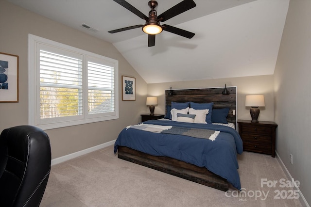 carpeted bedroom with ceiling fan and vaulted ceiling