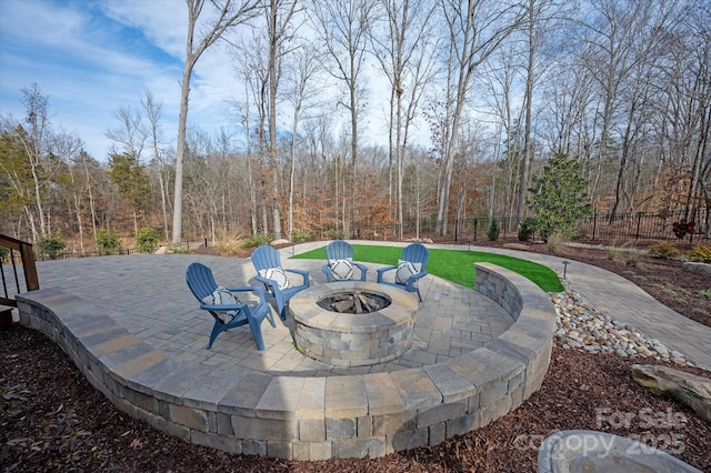 view of patio / terrace featuring a fire pit