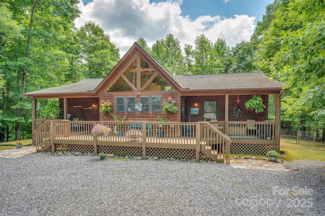 log home featuring a wooden deck