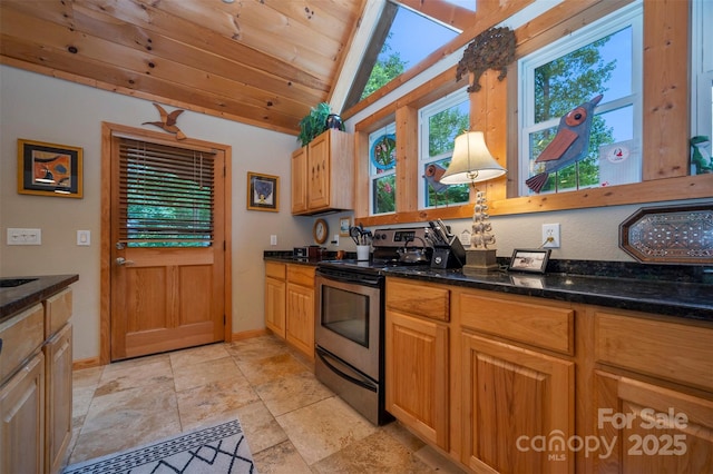 kitchen featuring vaulted ceiling with skylight, dark stone countertops, stainless steel electric stove, and wooden ceiling