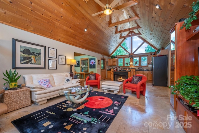 living room with ceiling fan, wood ceiling, beam ceiling, and high vaulted ceiling