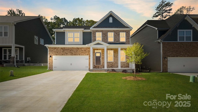 craftsman inspired home with a garage and a lawn