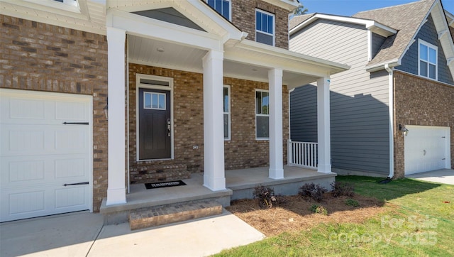 entrance to property with a porch and a garage