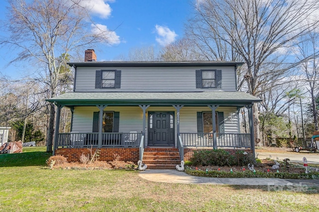 view of front facade featuring a front lawn and a porch