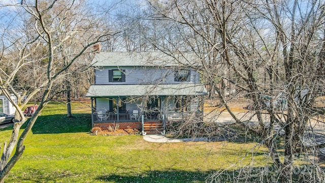 front of property featuring a front lawn and a porch