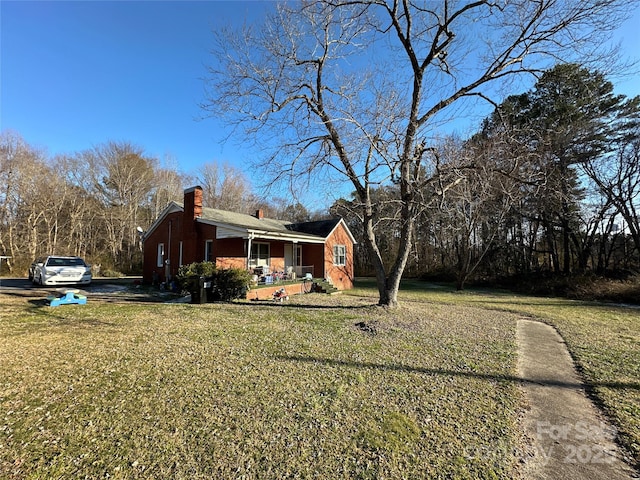 exterior space with a front lawn and a porch