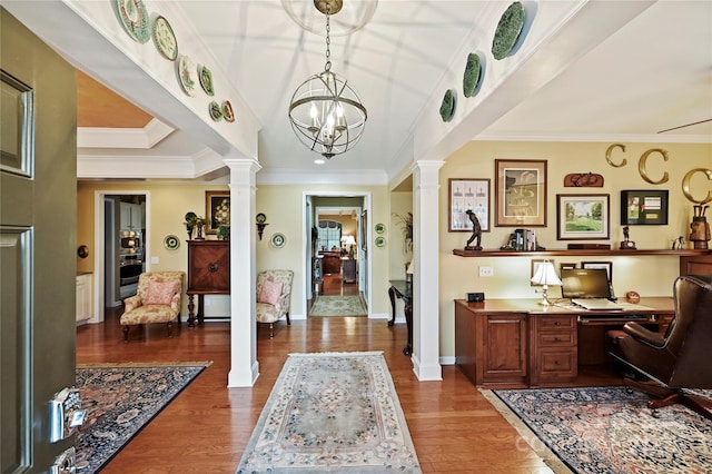 office with crown molding, decorative columns, and dark wood-type flooring