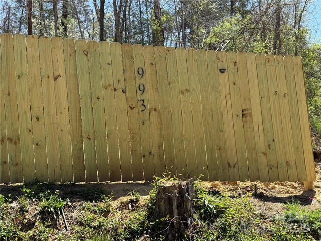 view of gate featuring fence