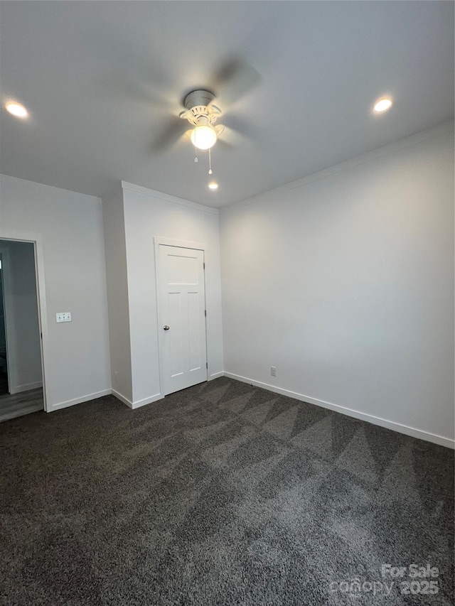 819 Wellwood Ave, Statesville, NC 28677 - spare room featuring dark colored carpet, a ceiling fan, recessed lighting, and baseboards