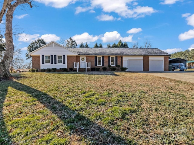 ranch-style home featuring a garage, a front yard, and a carport