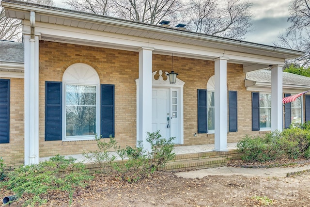 doorway to property with covered porch