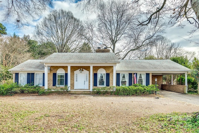 ranch-style home with a carport