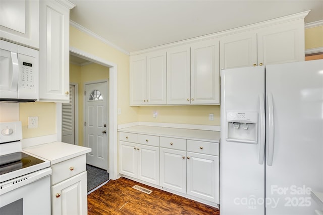 kitchen with white cabinetry, ornamental molding, and white appliances