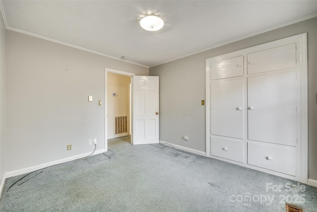 unfurnished bedroom with crown molding and light colored carpet