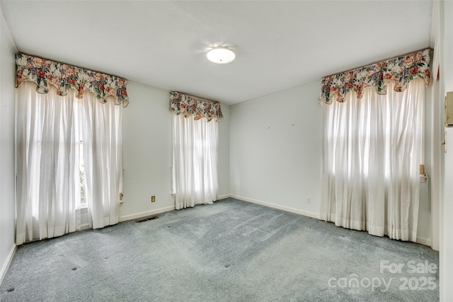 unfurnished room featuring carpet flooring