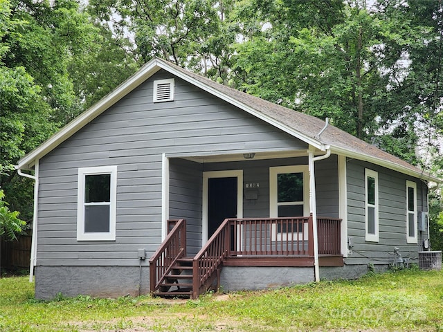 view of front facade with covered porch and central air condition unit