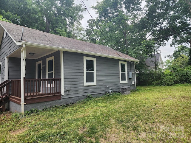 view of home's exterior with a yard