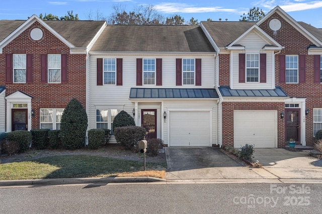 townhome / multi-family property featuring a garage