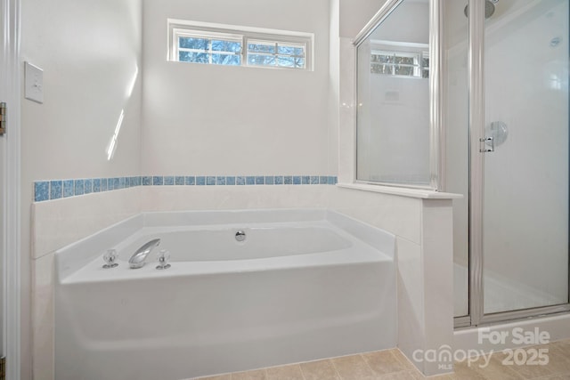 bathroom with tile patterned flooring and independent shower and bath