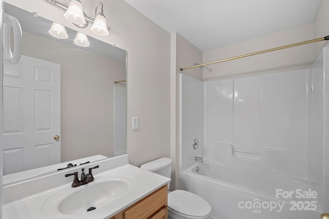 full bathroom with vanity, tub / shower combination, and toilet