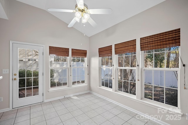 unfurnished sunroom with lofted ceiling, a wealth of natural light, and ceiling fan