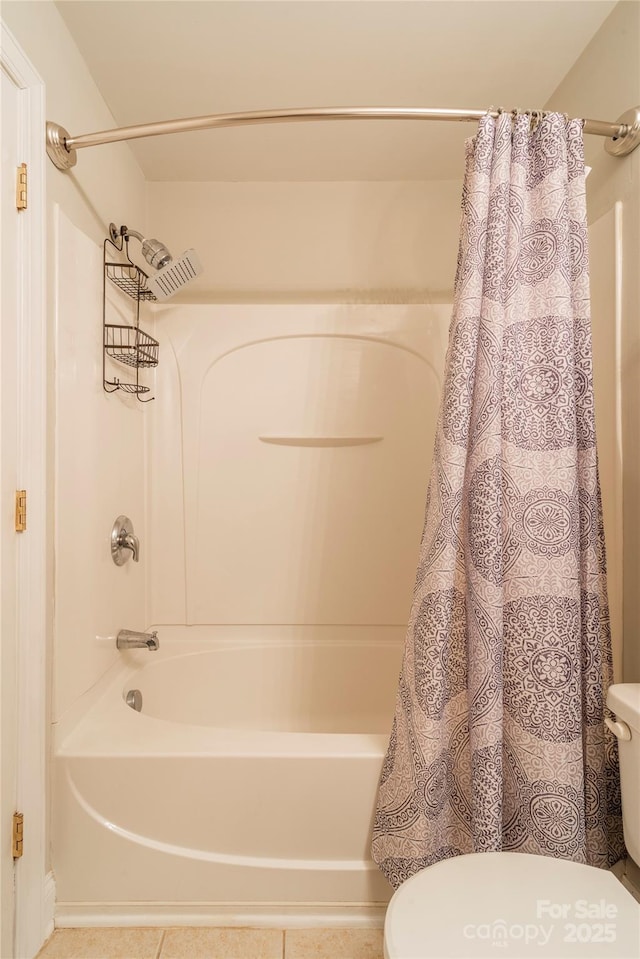 bathroom with toilet and shower / bath combo with shower curtain