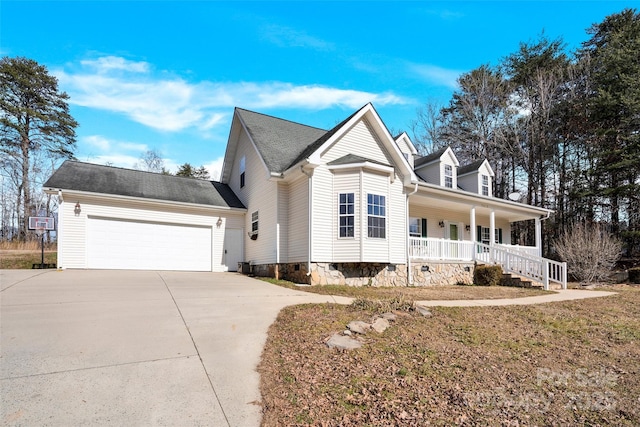 view of front of home with a porch and a garage