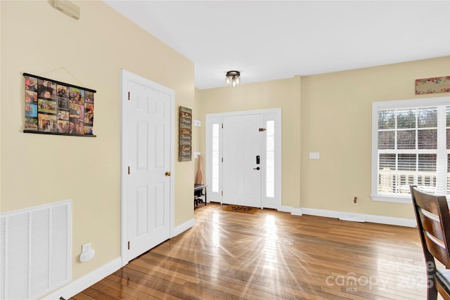 entrance foyer with hardwood / wood-style floors