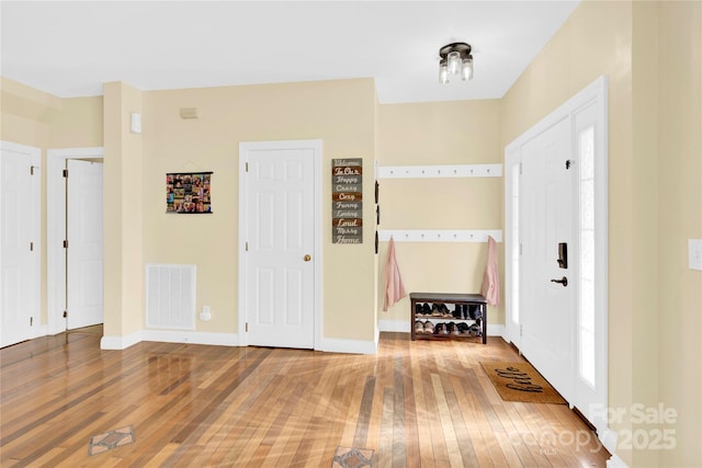 foyer entrance featuring hardwood / wood-style floors