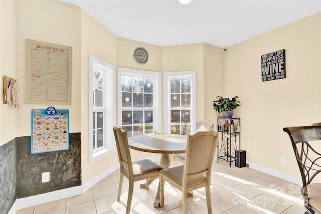 dining room featuring light tile patterned flooring