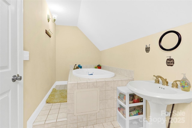 bathroom with lofted ceiling and tile patterned floors