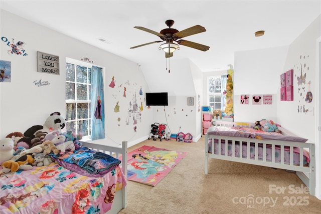 carpeted bedroom featuring vaulted ceiling and ceiling fan