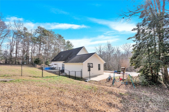 rear view of house with a yard and a patio