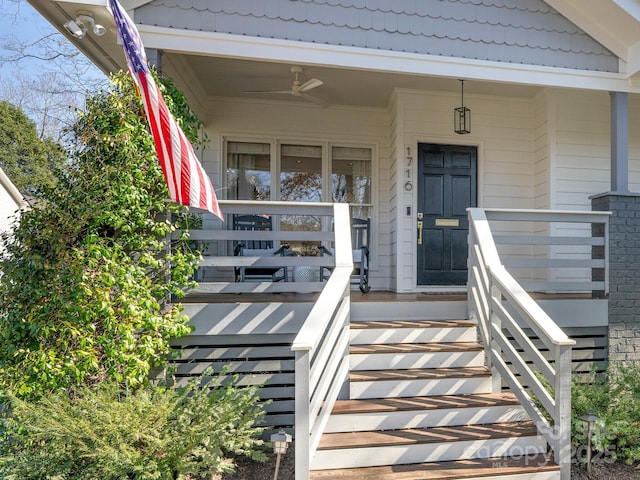 doorway to property with ceiling fan and covered porch