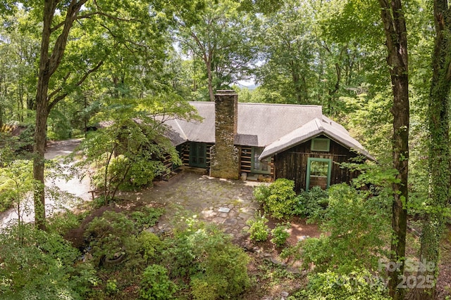 247 Skyuka Mountain Rd, Columbus, NC 28722 - view of front facade featuring a chimney and roof with shingles