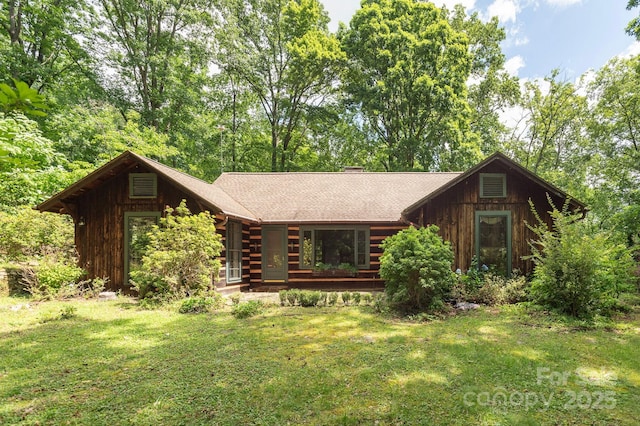 247 Skyuka Mountain Rd, Columbus, NC 28722 - log-style house with a front yard, a chimney, and a shingled roof