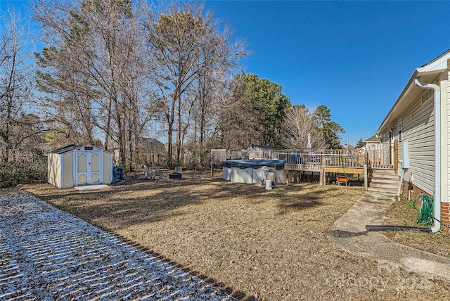 view of yard featuring a storage shed and a pool side deck