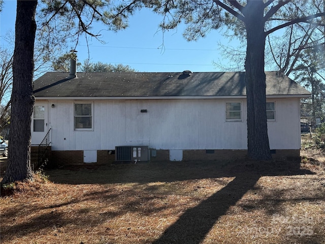 back of property with central AC