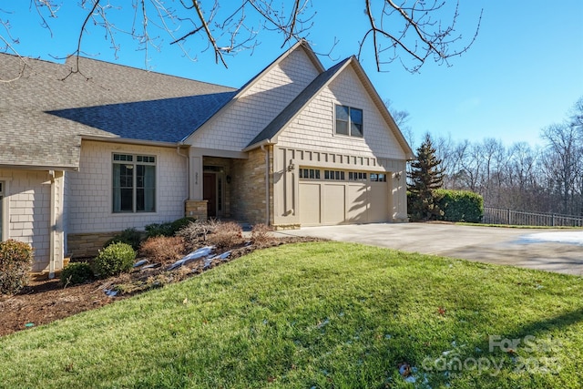 view of front facade with a garage and a front lawn